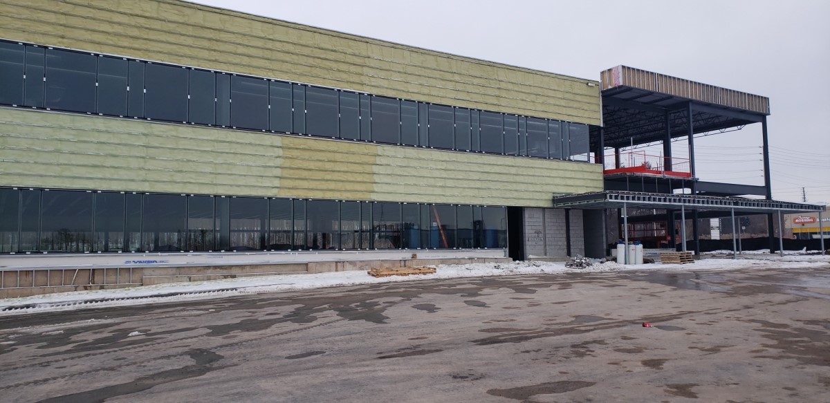 Commercial building under construction during envelope installation