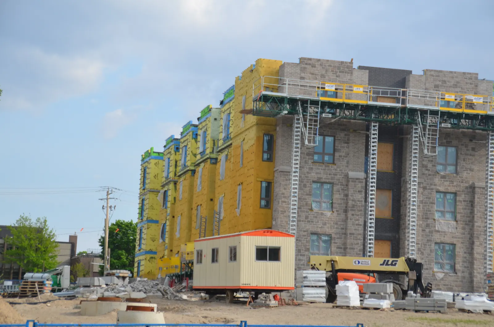 Mid-rise building with membrane-wrapped walls