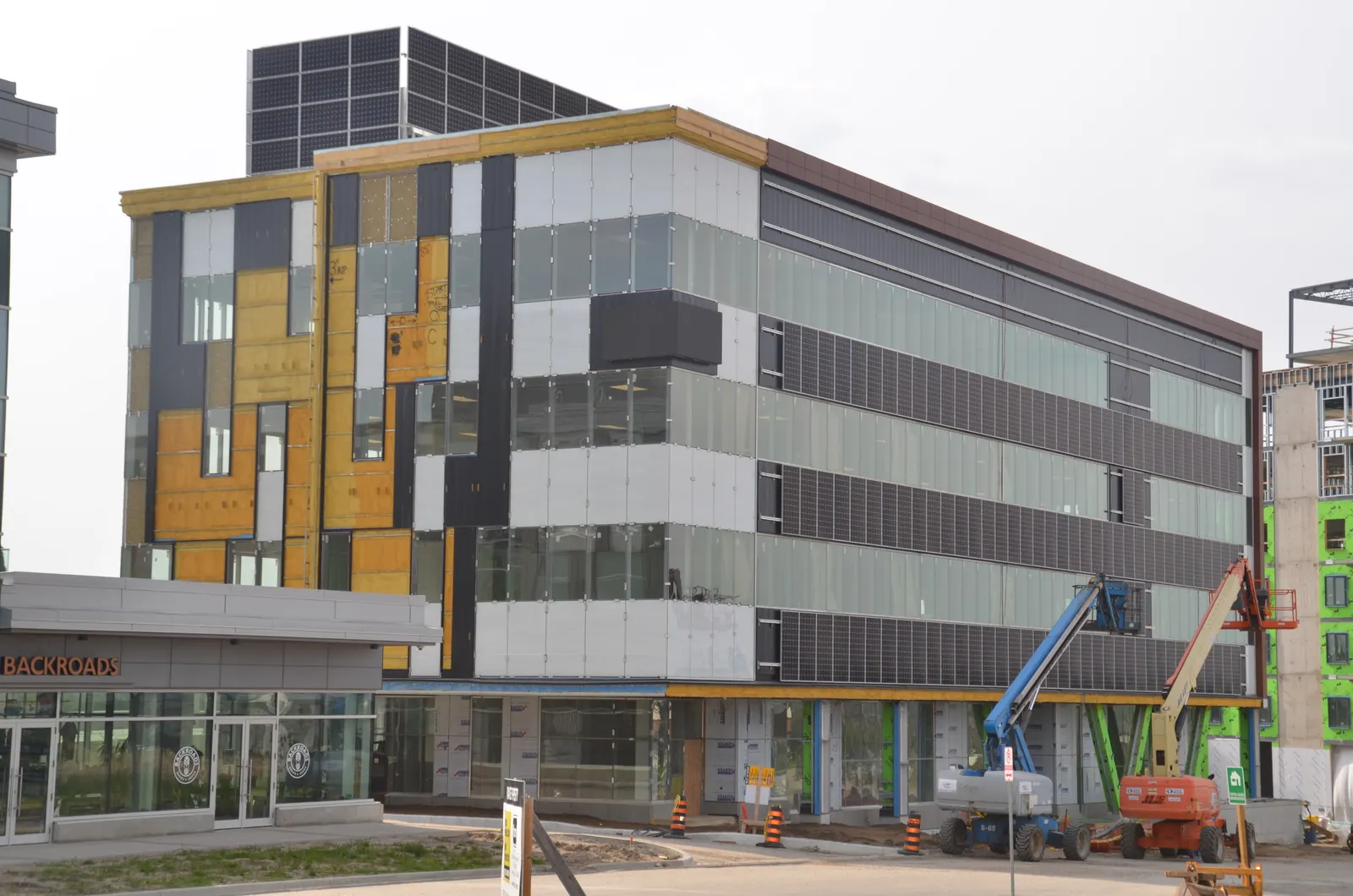 Mid-rise office building with a completed multi-colour envelope