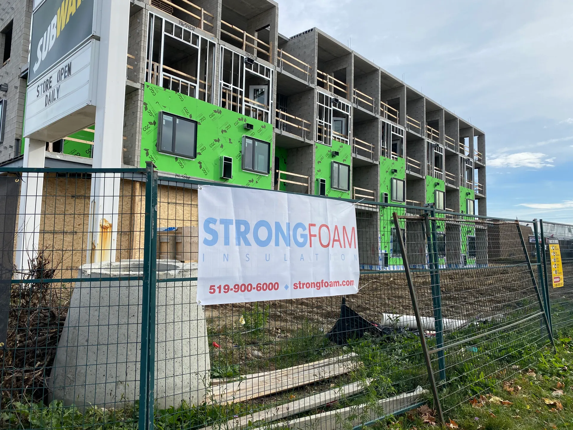 Strong Foam site banner on a multi-unit construction project