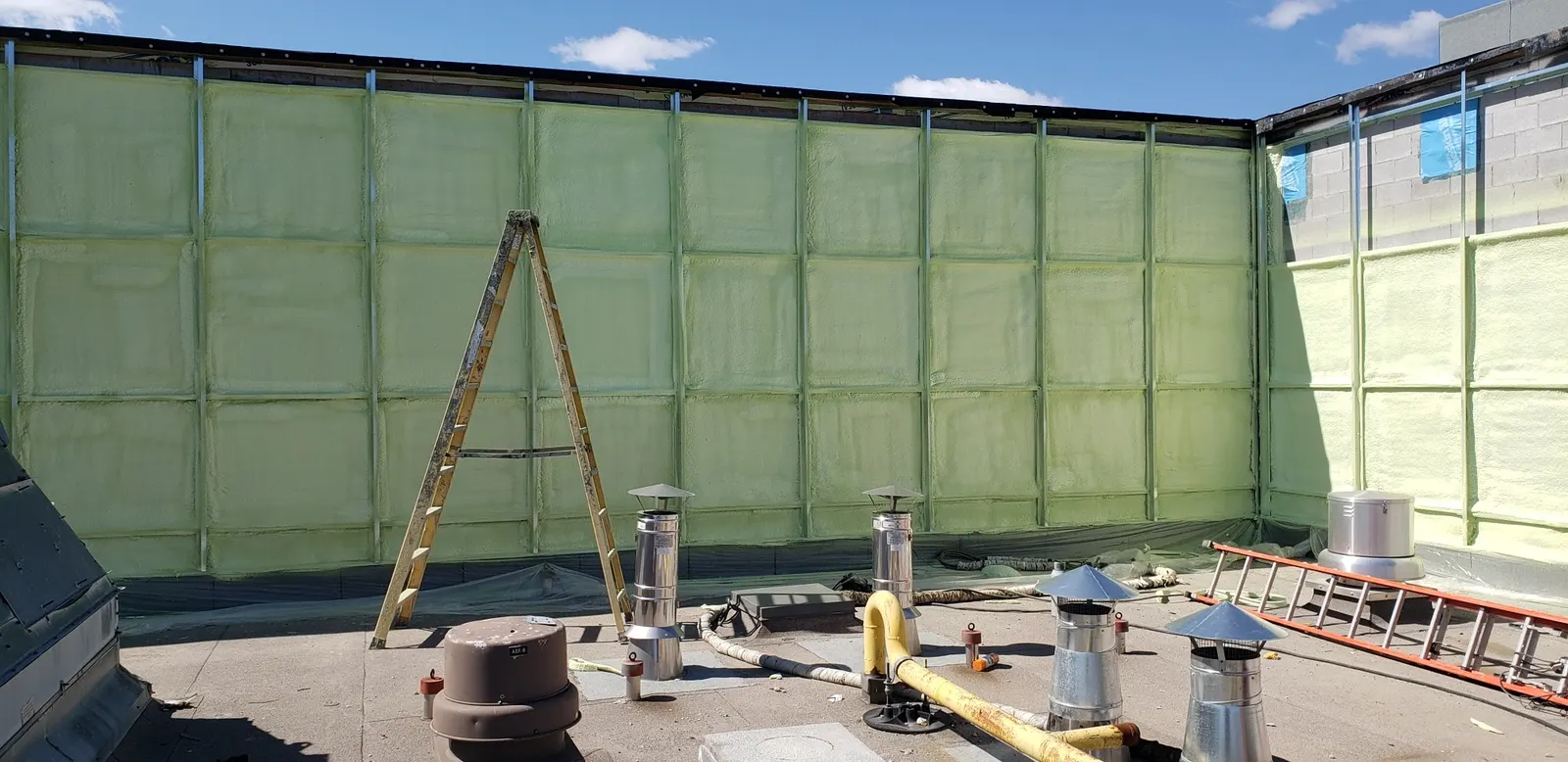 Exterior insulation installed across a commercial wall assembly