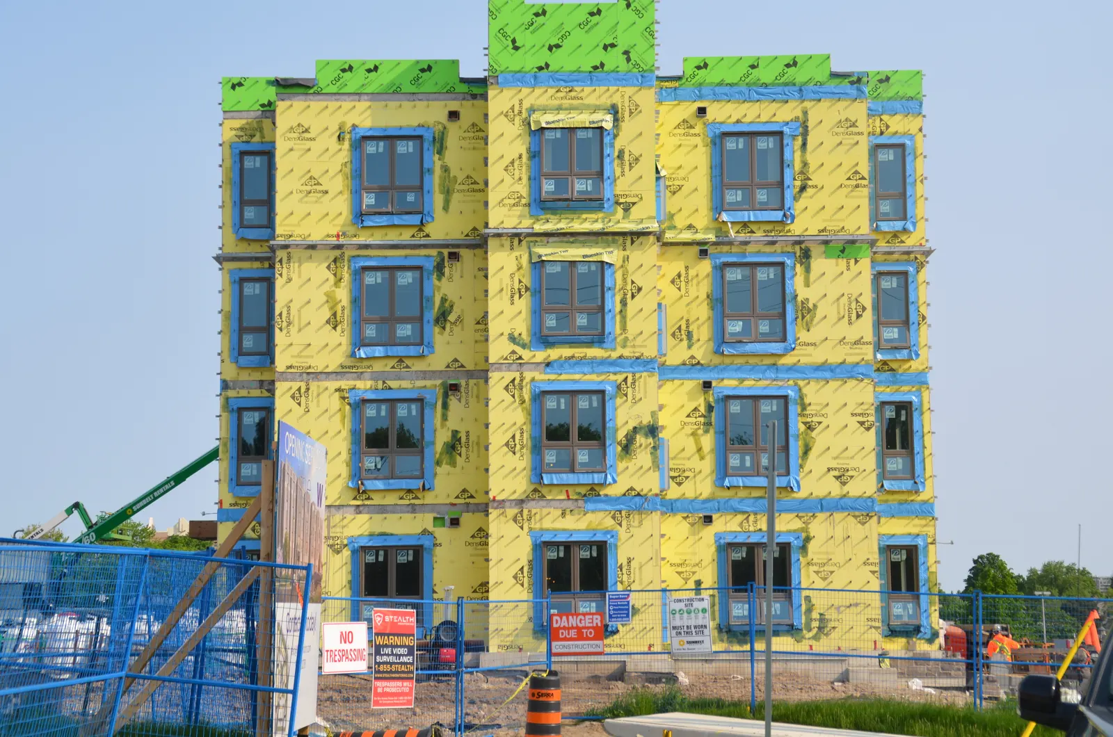 Self-adhered membrane around windows on a mid-rise wall